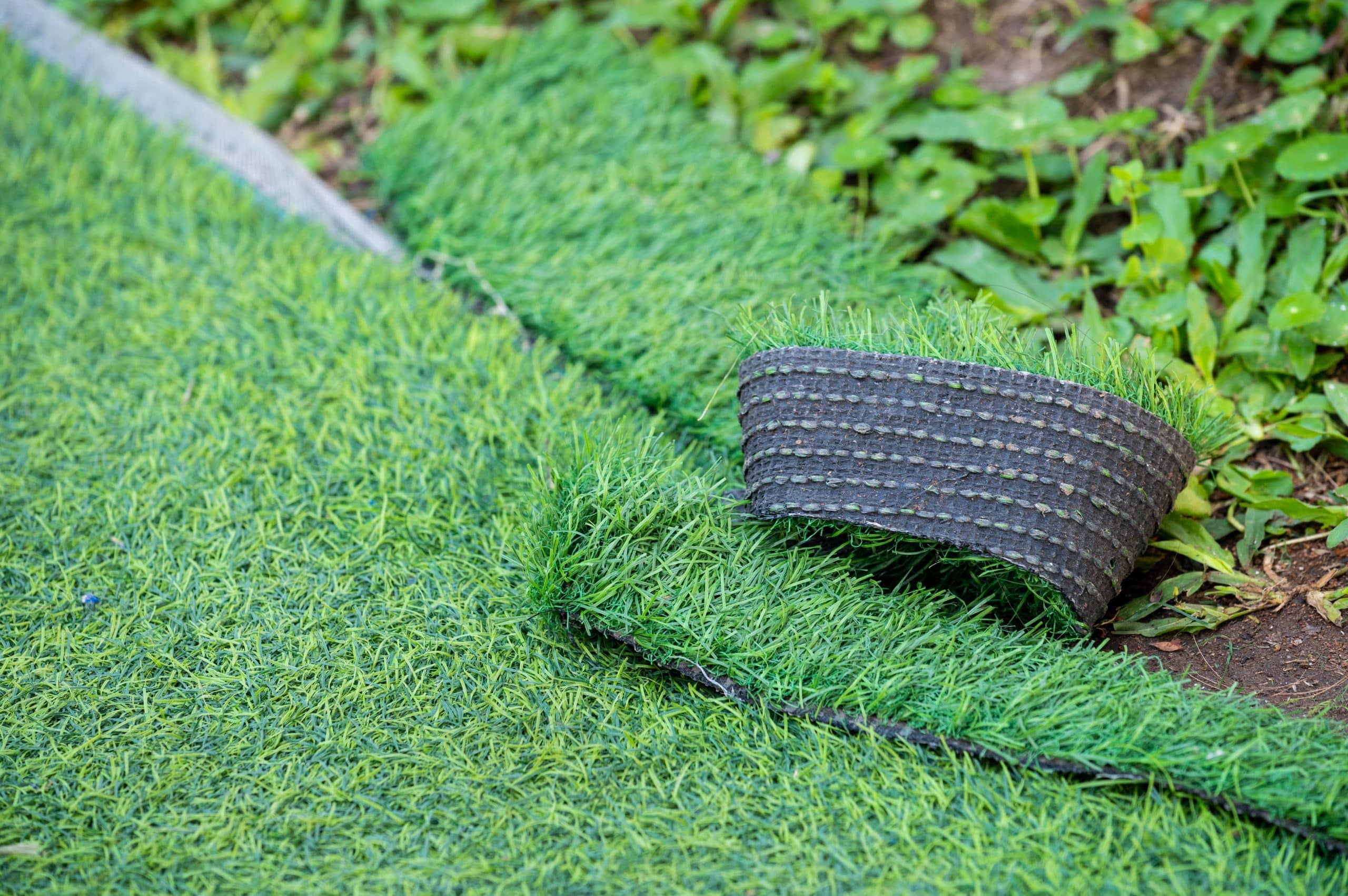 Artificial grass installation in a Flower Mound family yard